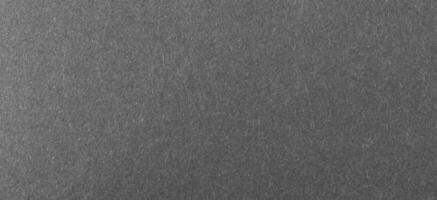 black sheet of paper with a visible texture photo