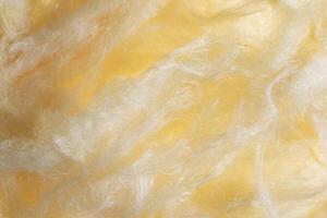 yellow mineral wool with a visible texture. photo