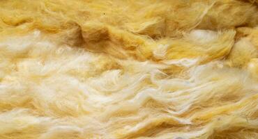 yellow mineral wool with a visible texture. background. photo