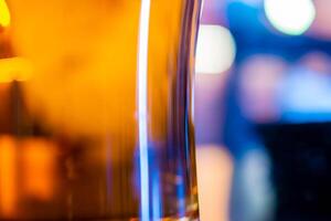 a mug of beer on the background of a tangled table top. photo