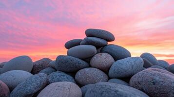 Sunset stones pile coastal beach nature photography tranquil environment vibrant background photo
