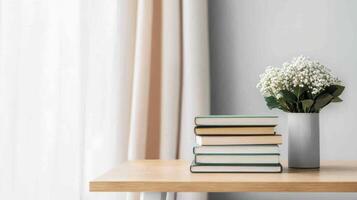 Cozy reading space with books and flowers home still life minimalist natural light background photo
