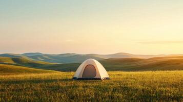 Camping tent in serene meadow at sunrise nature background inspirational travel photography photo