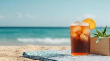 Refreshing iced tea drink on a sandy beach with ocean background relaxing lifestyle scene photo