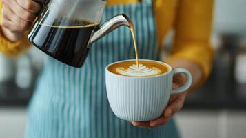 Pouring coffee latte art home kitchen beverage photography cozy atmosphere close-up background inspiration photo