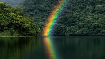 Vibrant rainbow reflection over tranquil lake lush green background nature photography serene environment photo