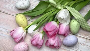Tulips and easter eggs create a spring feeling on a table video