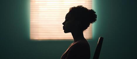 Contemplative moments a woman in profile against a nature-themed background indoor setting artistic viewpoint photo