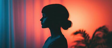 Silhouette of a woman against vibrant background nature-inspired artistic composition intimate environment side view photo