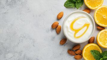 Refreshing yogurt with honey and lemon nature background food composition bright environment top view healthy concept photo