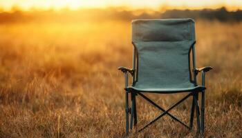 Relaxing Lightproof Canvas Camping Chair in Nature Background with Copyspace Stunning Evening Glow photo