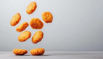 Floating Chicken Nuggets Against a Gray Background Whimsical Copyspace Scene Creative Food Photography photo