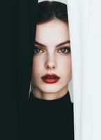 Elegant Stylish Woman with Captivating Expression Studio Background Portrait Copyspace photo