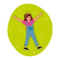 Child enjoying a sunny day making snow angels on green grass in a park vector