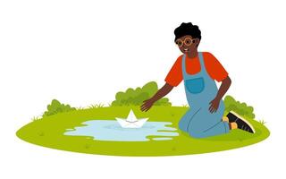 Child playing with paper boat in a small pond during a sunny afternoon in a green park vector