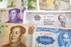 Stack of Chinese Renminbi and Vietnamese Dong photo