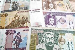 Stack of Russian Rubles and Mongolian Togrog photo