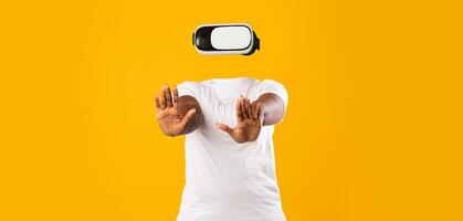 A user engages with virtual reality in a modern setting. Wearing a headset, they raise their hands, fully immersed in an imaginative experience that transcends reality. photo