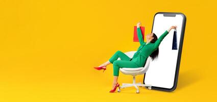 A happy customer with shopping bags relaxes in a chair while engaging with a large smartphone display. The bright background emphasizes online shopping convenience. photo