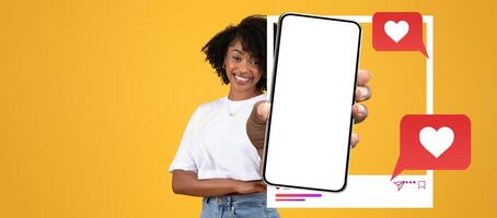 A blogger enthusiastically displays a smartphone in front of a bright yellow backdrop. The screen is blank, inviting creativity while chat bubbles suggest active social media interactions. photo