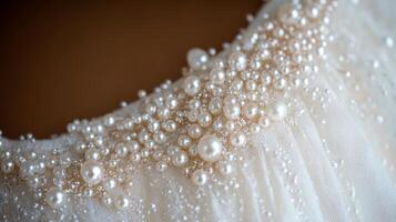 The close-up view showcases an exquisite arrangement of pearls on delicate fabric. Each pearl varies in size, creating a stunning texture that enhances the overall elegance. photo