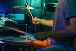 Drummer In Stage With Colorful Lights photo