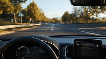 Open road view from car dashboard. Scenic drive through autumn trees photo