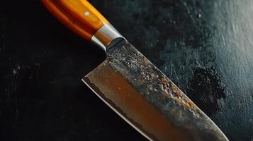 Close-up of a chef's knife with a distinctive blade photo