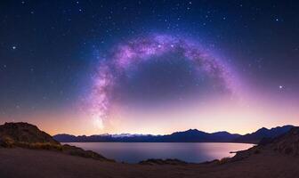 Milky Way arch over serene lake and mountains photo