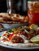 Delicious chicken wrap with fresh vegetables, creamy sauce, and warm pita photo