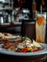 Grilled chicken, eggs, and vegetables with a refreshing drink photo