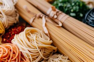 Assorted pasta types, various colors and shapes photo