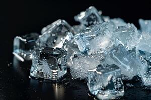 Clear ice cubes cluster on dark surface photo