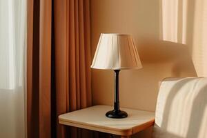 Warm sunlight illuminates a simple table lamp photo