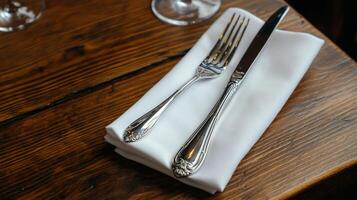 Elegant table setting with silverware and napkin photo