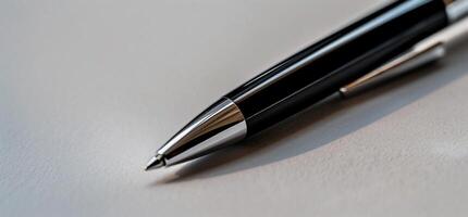 A close up of a pen on a table photo