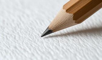 Close-up of a pencil point on textured paper photo