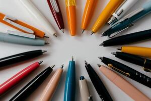 Colorful pens arranged in a circle. A variety of colors and styles photo