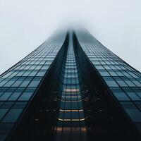 Modern skyscraper, reaching for the clouds photo