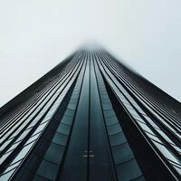 Modern skyscraper reaching into the sky. Foggy, high-angle view photo