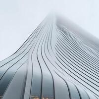 Modern architectural facade, smooth flowing lines, and reflective glass panels. Exterior view of a skyscraper photo