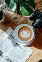 Relaxing coffee break with newspaper photo