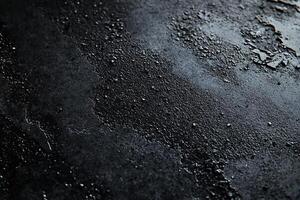 Dark, textured surface with mottled, distressed finish photo