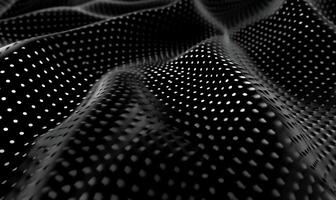 Abstract wavy pattern with a perforated texture. A dark, smooth, flowing surface with a repeating pattern of small holes photo