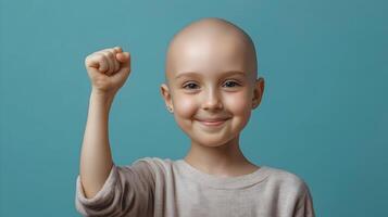 A child stands firm, eyes gleaming with an unwavering resolve on a teal backdrop photo