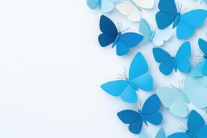 Delicate paper butterflies in various shades of blue arranged on a pastel background evoke a serene and airy atmosphere suitable for creative projects photo