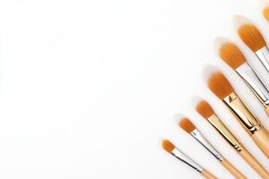 Paintbrushes neatly arranged on a white background in varying sizes, highlighting the details of the bristles and the clean lines of each brush photo