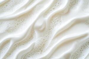 Top-down slow motion capture shows a splash of fresh milk with suspended droplets, highlighting its fluid dynamics and purity photo