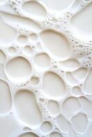 Top-down studio capture of a milk splash in slow motion, emphasizing the dynamic shapes and suspended droplets, conveying a sense of purity and freshness photo