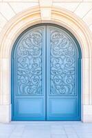 Gray arched door with intricate ironwork adorning a European stone building in a picturesque architecture setting photo